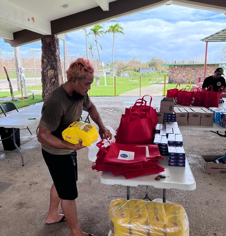 Guam Mawar volunteer packing bag