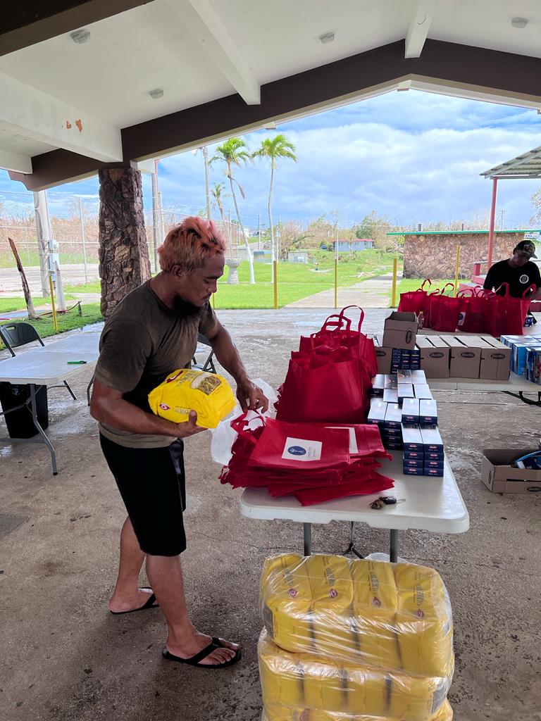 Guam Mawar volunteer packing bag
