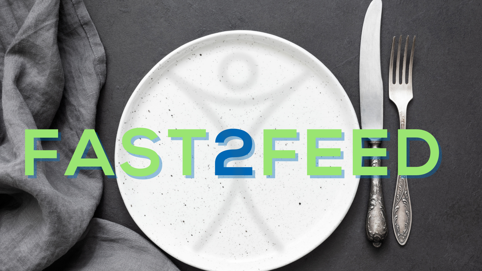 An image of a dinner plate with fork and knife. The plate has part of the Humanity First that looks like a man, and the images reads Fast 2 Feed.
