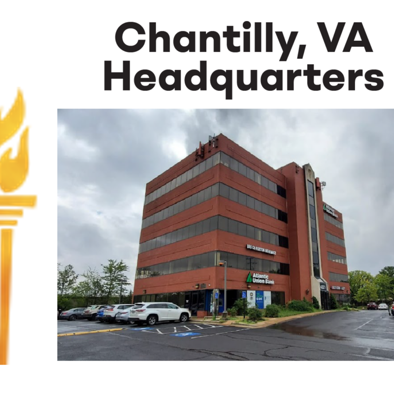 A five story brick building stands on a street corder. The title is Chantilly VA headquarters. Next to it is a large drawn image of an olympic style torch.