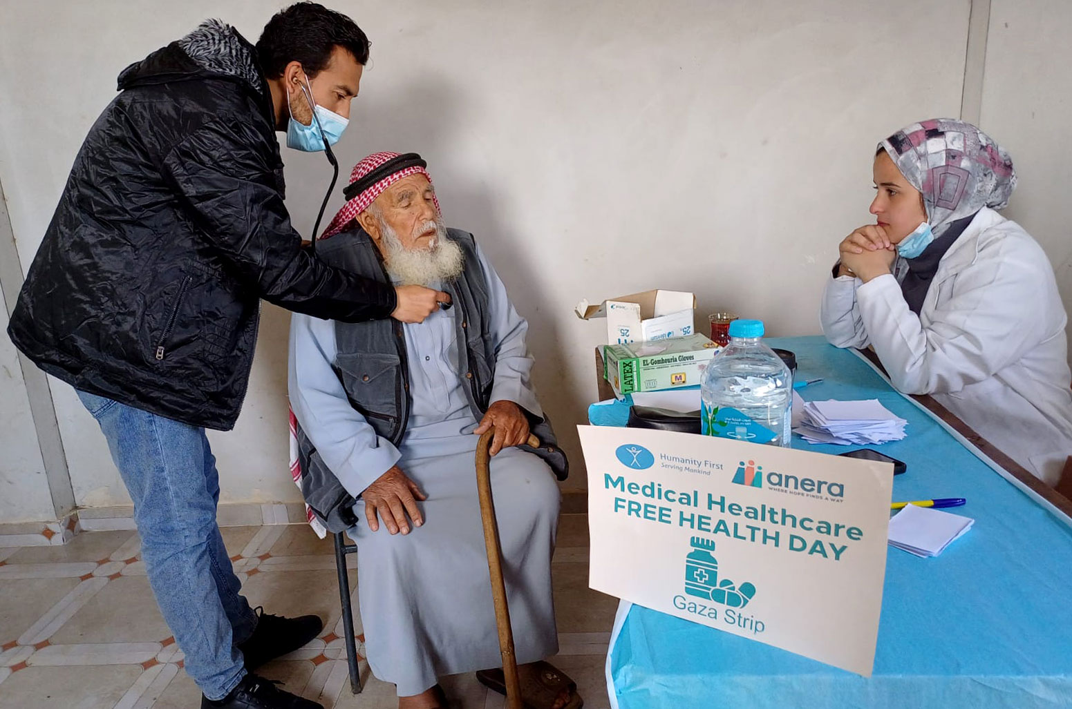 DR Gaza Anera health clinic 20240210 elderly man being checked by doctor