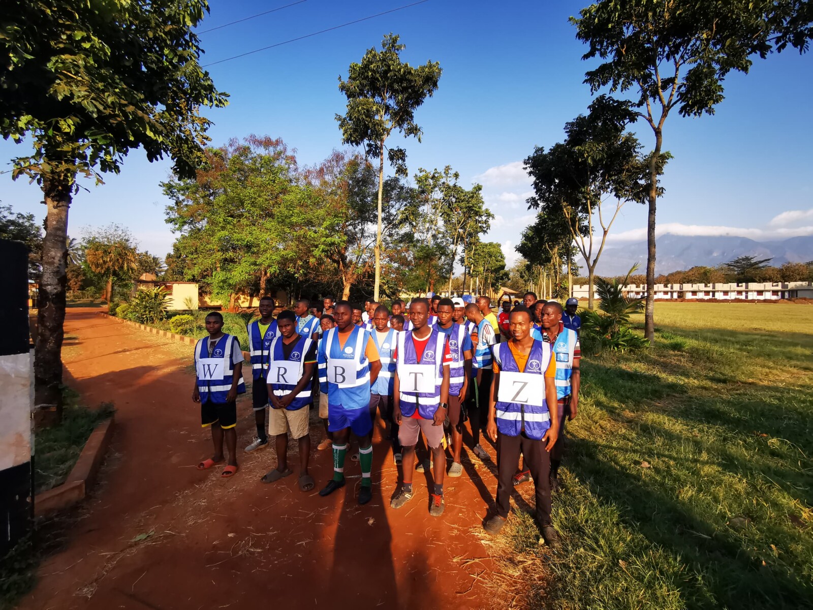 WRB Tanzania 20240905 group with WRBTZ sign