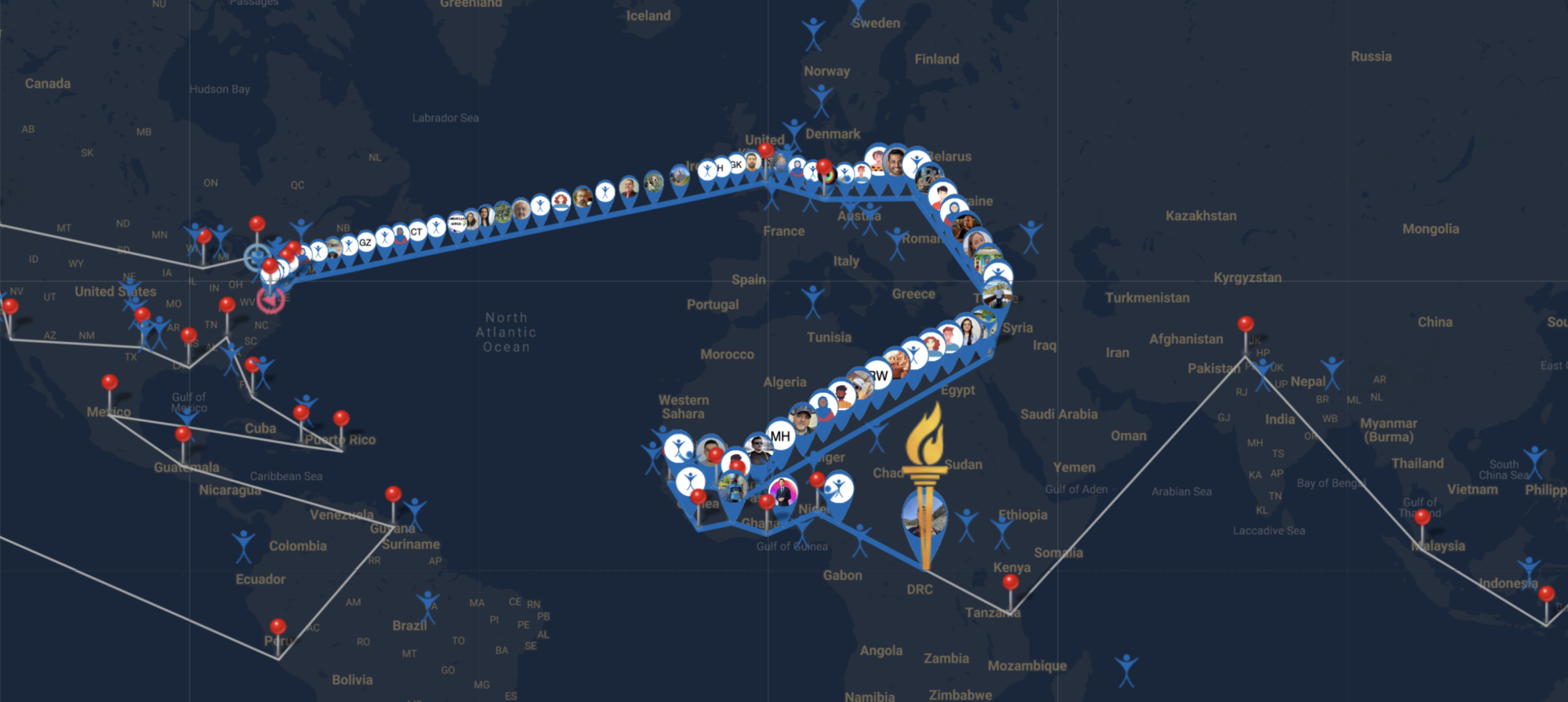 A map showing the United States Europe and Africa with a line for a route and pins to denote places. A drawing of a torch is showing on in the middle of the African continent followed by small icons of people participating along the route.