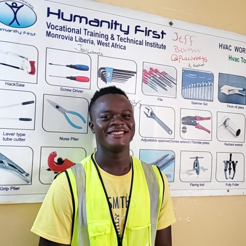 K4L HFAVC Liberia 2021 student with HVAC poster