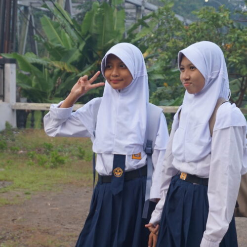 OC Indonesia two siblings in school uniforms horizontal