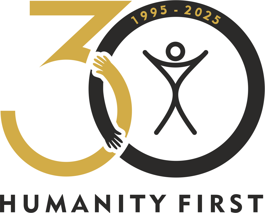 A logo of the number 30 where the curves of the 3 and 0 intersect they look like arms giving each other a hug. The text reads Humanity First 1995-2025.