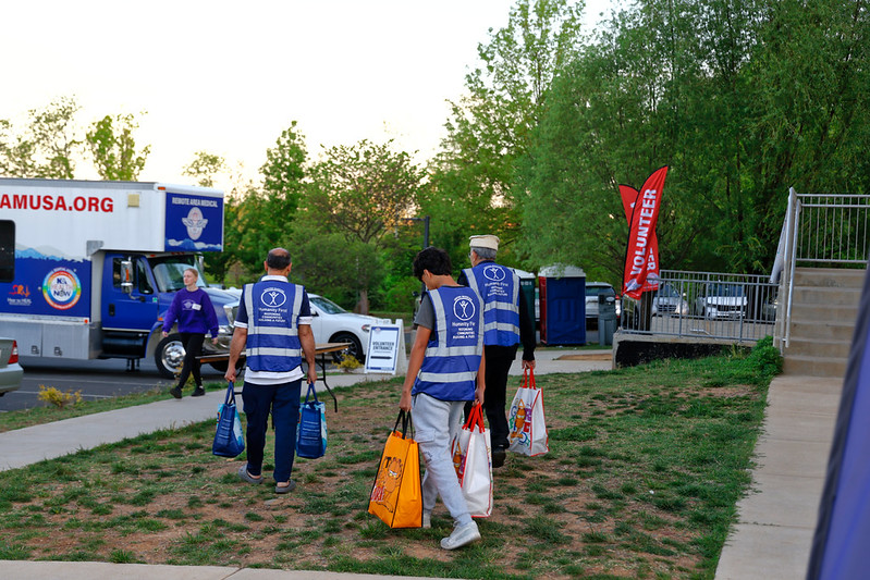 RAM clinic 20260418 HF volunteers carrying bags